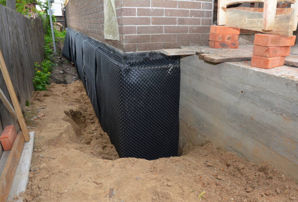 Happy homeowners after waterproofing job in Kokomo
